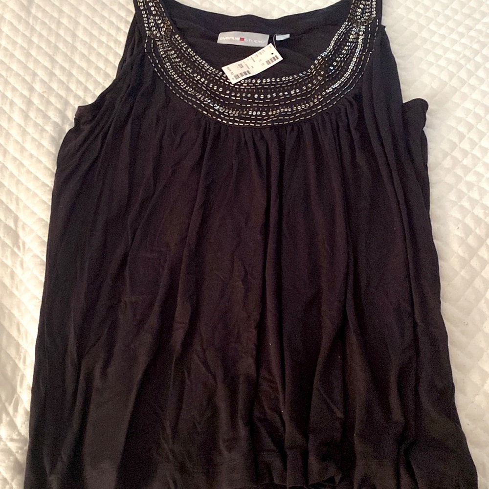 Atank style top with beaded front. 20 inches from under the arm. Soft stretchy